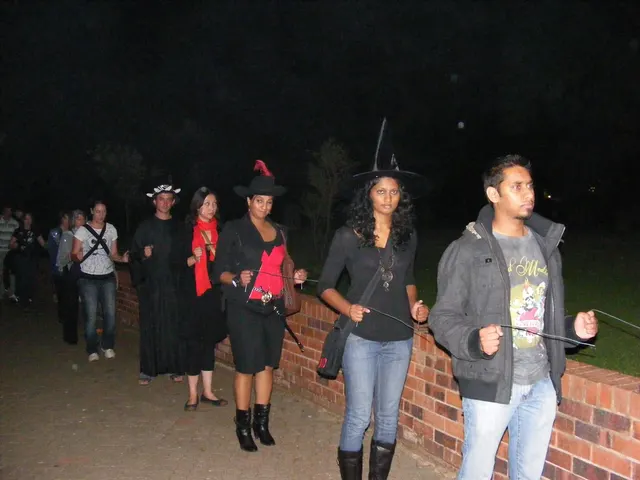 Guests holding rods during a group night walk