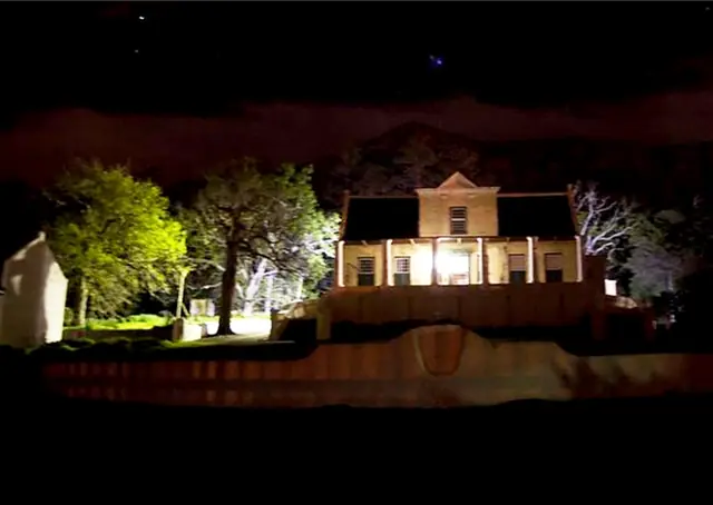 Tokai Manor and nearby trees illuminated at night